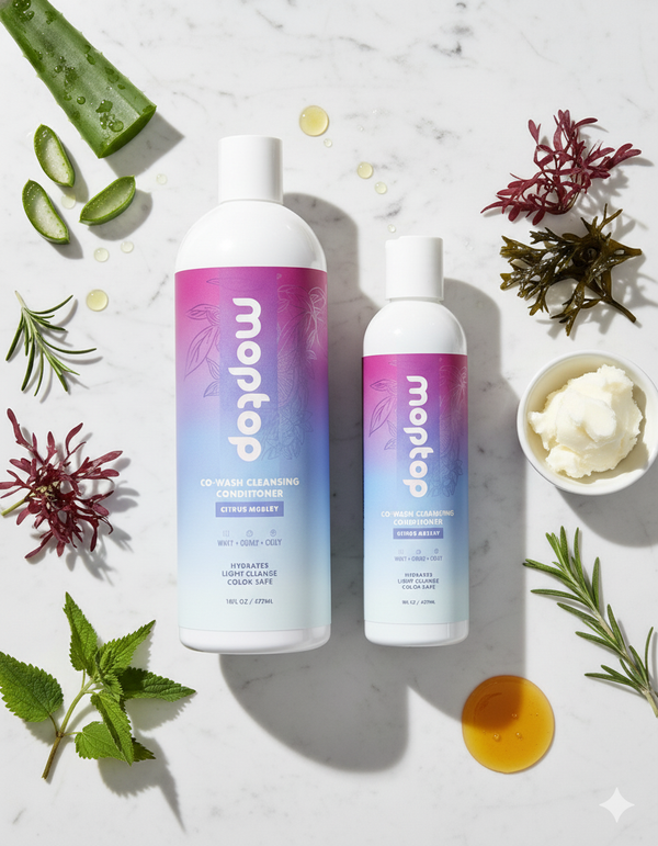 2 Bottles of Co-Wash Cleansing Conditioner surrounded by seaweed, honey, mint, and aloe vera