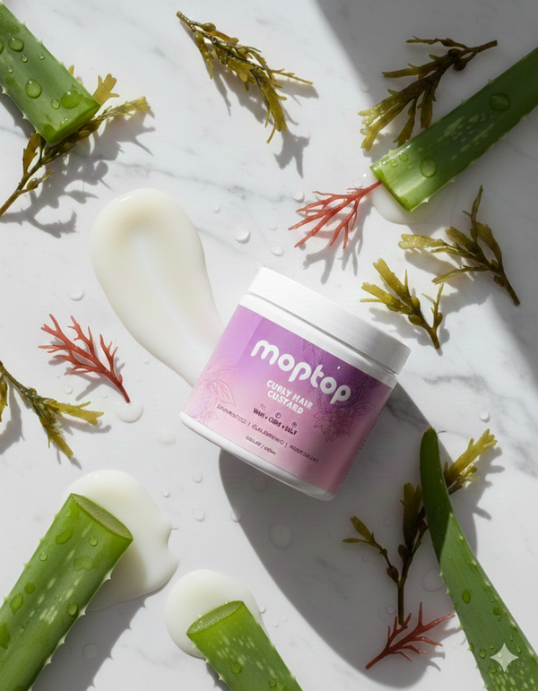 Curly hair custard jar surrounded by seaweed and aloe vera