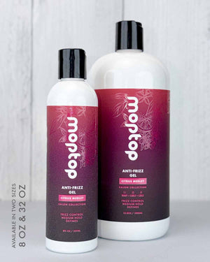 An 8 ounce and 32 ounce bottle of Salon Anti Frizz Gel