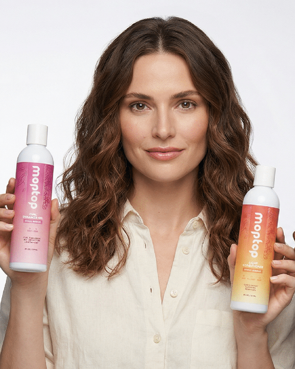 A woman holding bottles of Leave In Conditioner and Light Conditioner