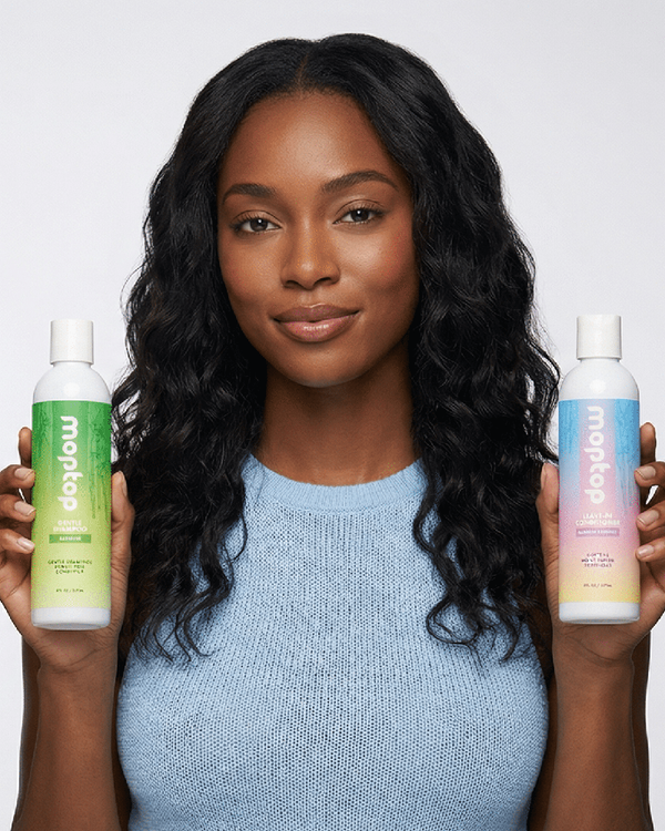 A woman holding bottles of Gentle Shampoo and Curly Hair Gel