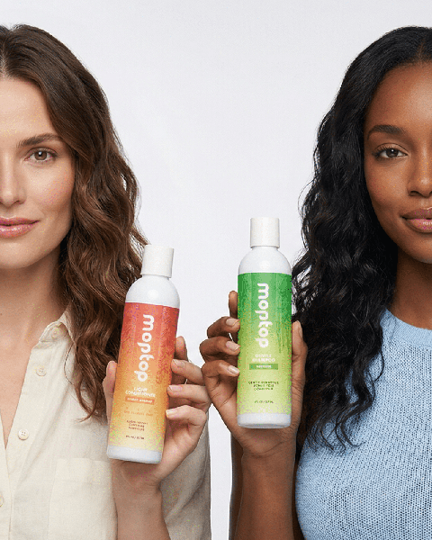 Two women holding Gentle Shampoo and Light Conditioner bottles.